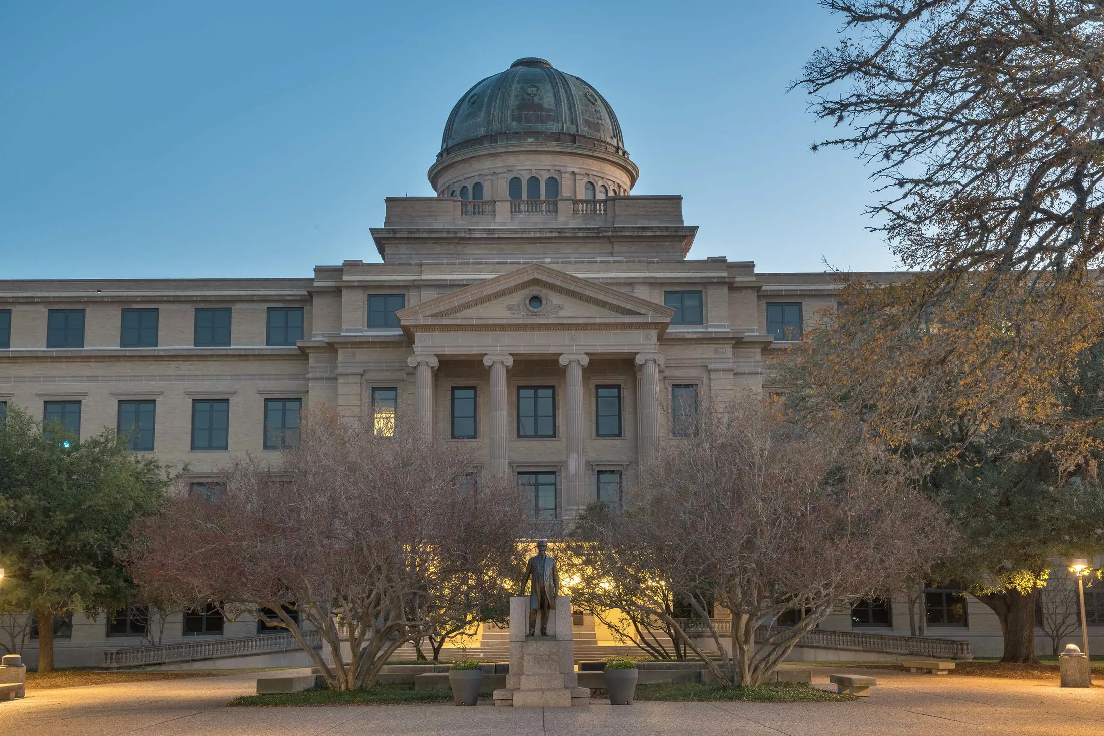 The Academic Building at Texas A&M University at dusk.